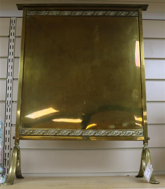 A pair of Edwardian Dutch brass three branch wall lights and a firescreen